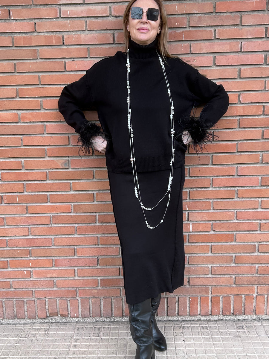 Conjunto de punto de jersey de cuello alto y falda recta