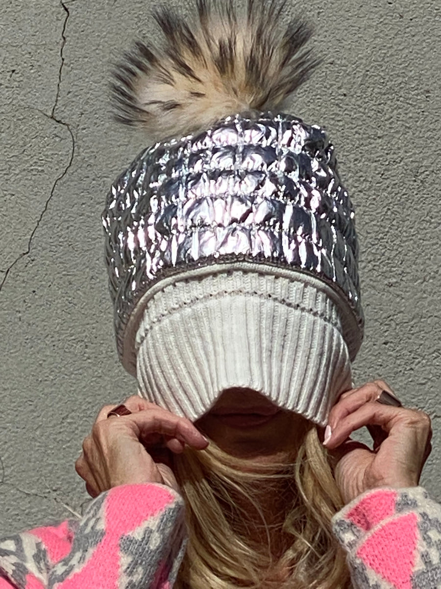 Metallic hat lined with natural leather tassel